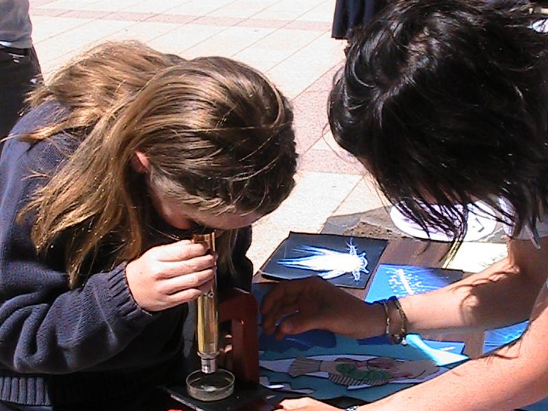 child using microscope