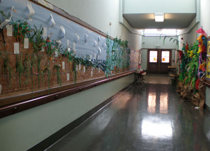 Long hallway full of Ocean art work