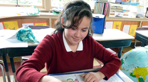 Girl working on a MARE project in elementary school